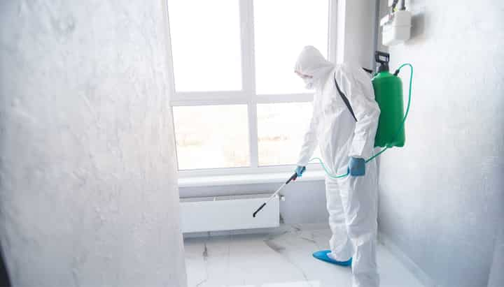 A certified mold inspector using specialized equipment to identify and locate mold growth in a residential property in West Palm Beach